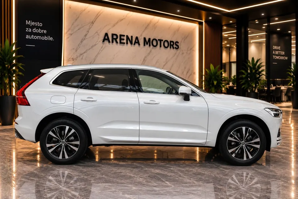 Bijeli Volvo XC60 u profilu, desna strana, s alu felgama