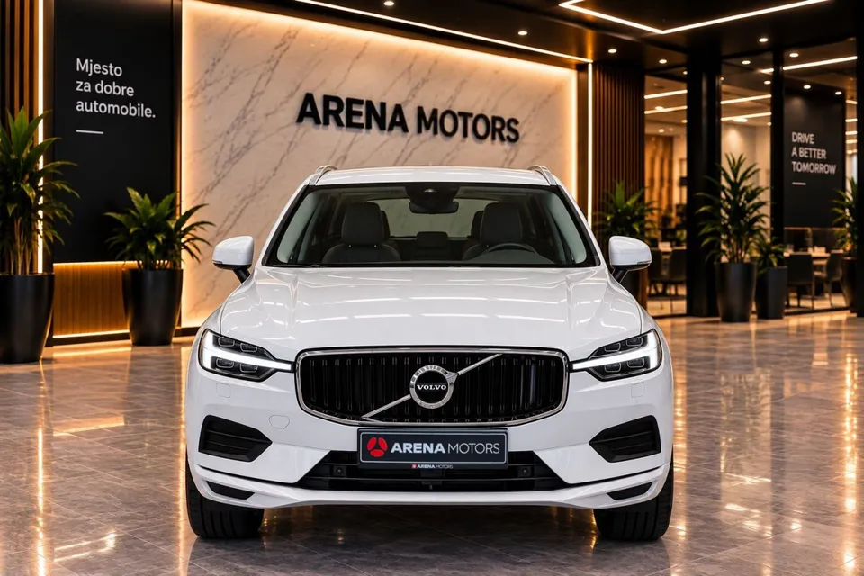 Bijeli Volvo XC60 snimljen sprijeda, vidi se maska s Volvo znakom i LED svjetla